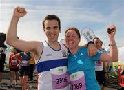 20 August 2011; Sean McDonnell, from Kildare, and Aoife Kerrigan, from Dublin, celebrate after finishing the National Lottery Frank Duffy 10 Mile race, Phoenix Park, Dublin. Picture credit: Pat Murphy / SPORTSFILE