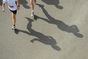 20 August 2011; The shadows of athletes in action during the National Lottery Frank Duffy 10 Mile race, Phoenix Park, Dublin. Picture credit: Pat Murphy / SPORTSFILE