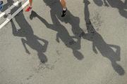 20 August 2011; The shadows of athletes on the road during the National Lottery Frank Duffy 10 Mile race, Phoenix Park, Dublin. Picture credit: Pat Murphy / SPORTSFILE