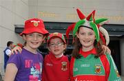 21 August 2011; Mayo supporters Mary, 12 years, Anne, 6 years, and Sarah, 12 years, from Knockmore, Ballina, at the GAA Football All-Ireland Football Championship Semi-Finals. Croke Park, Dublin. Picture credit: Ray McManus / SPORTSFILE