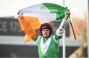 15 March 2017; Jamie Codd celebrates with the tricolour as he enters the winner's enclosure after winning the Weatherbys Champion Bumper on Fayonagh during the Cheltenham Racing Festival at Prestbury Park in Cheltenham, England. Photo by Cody Glenn/Sportsfile