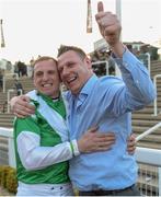 15 March 2017; Jockey Jamie Codd celebrates with friend Ian O'Connell, from East Cork, after winning the Weatherbys Champion Bumper on Fayonagh during the Cheltenham Racing Festival at Prestbury Park in Cheltenham, England. Photo by Cody Glenn/Sportsfile