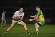 15 March 2017; Paul Donaghy of Tyrone in action against Emmett McNabb of Donegal during the EirGrid Ulster GAA Football U21 Championship Quarter-Final match between Tyrone and Donegal at Healy Park in Omagh, Co Tyrone. Photo by Philip Fitzpatrick/Sportsfile