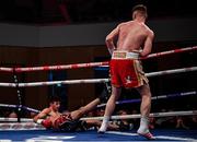 10 March 2017; James Tennyson knocks down Declan Geraghty during their Irish super-featherweight title bout in the Waterfront Hall in Belfast. Photo by Ramsey Cardy/Sportsfile