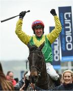 17 March 2017; Jockey Robbie Power celebrates as he enters the winners enclosure after winning the Timico Cheltenham Gold Cup on Sizing John during the Cheltenham Racing Festival at Prestbury Park in Cheltenham, England. Photo by Seb Daly/Sportsfile