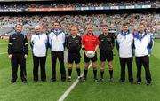 31 July 2011; Referee Pat McEnaney, red jersey, along with officials from left, Jerome Henry, sideline official, Jimmy Finnegan, Mark Gilsenan, umpires, Eddie Kinsella, linesman, Padraig Hughes, linesman, Jimmy Galligan and Joe McQuillan, umpires. GAA Football All-Ireland Senior Championship Quarter-Final, Kerry v Limerick, Croke Park, Dublin. Picture credit: Oliver McVeigh / SPORTSFILE