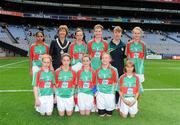 21 August 2011; INTO President Noreen Flynn with the Mayo girls football team, back row, left to right, Ketlyn Fonseca, Presentation N.S., Fermoy, Co. Cork, Eileen Flannery, St. Michael's N.S., Clonmel, Co. Tipperary, Emma Quinn, St. Manachan's N.S., Mohill, Co. Leitrim, Catr’ona Kirwan, Scoil Naomh Pádraig, Ballyroan, Co. Dublin, front row, left to right, Dearbhla Mulholland, St. Mary's N.S., Glenview, Maghera, Co. Derry, Emma Gildea, St. Mary's N.S., Dungarvan, Co. Waterford, Katie Todd, St. Oliver Plunkett's N.S., Blackrock, Co. Louth, Amy Burke, Scoil Chaoimh’n Naofa, Hollywood, Co. Wicklow, Mary Anne Murphy, St. Georges' RC School, Harrow, England. Go Games Exhibition - Sunday 21st August 2011, Croke Park, Dublin. Picture credit: Dáire Brennan / SPORTSFILE