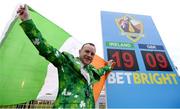 17 March 2017; Rory Fitzgerald, from Clondalkin, Dublin, celebrates with the tricolour next to the final tally of 19-9 in favour of the Irish in the BetBright Cup, traditionally known as the Prestbury Cup, following the Cheltenham Racing Festival at Prestbury Park in Cheltenham, England. Photo by Cody Glenn/Sportsfile