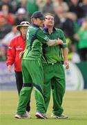 25 August 2011; Ireland's Paul Stirling is congratulated by team-mate William Porterfield, left, after catching out England's Eoin Morgan. RSA Challenge ODI, Ireland v England, Clontarf Cricket Club, Clontarf, Dublin. Picture credit: Pat Murphy / SPORTSFILE