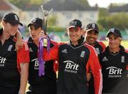 25 August 2011; England Captain Eoin Morgan lifts the RSA Challenge Trophy, surrounded by his team-mates. RSA Challenge ODI, Ireland v England, Clontarf Cricket Club, Clontarf, Dublin. Picture credit: Pat Murphy / SPORTSFILE