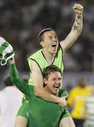 25 August 2011; Gary Twigg, Shamrock Rovers, celebrates by carrying team-mate Gary McCabe after the game. UEFA Europa League Play-off Round Second Leg, Shamrock Rovers v FK Partizan Belgrade, FK Partizan Stadium, Belgrade, Serbia. Picture credit: Srdjan Stevanovic / SPORTSFILE