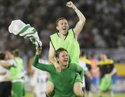 25 August 2011; Gary Twigg, Shamrock Rovers, celebrates by carrying team-mate Gary McCabe after the game. UEFA Europa League Play-off Round Second Leg, Shamrock Rovers v FK Partizan Belgrade, FK Partizan Stadium, Belgrade, Serbia. Picture credit: Srdjan Stevanovic / SPORTSFILE
