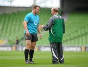 26 August 2011; Ireland's Cian Healy in conversation with Head Coach Declan Kidney during the Squad Captain's run ahead of their Rugby World Cup warm-up game against England on Saturday. Aviva Stadium, Lansdowne Road, Dublin. Picture credit: Conor O Beolain / SPORTSFILE