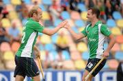 26 August 2011; Ireland's Eugene Magee, left, celebrates with team-mate Peter Caruth, after scoring his side's fourth goal. Ireland v Russia - GANT EuroHockey Nations Men's Championships 2011. Warsteiner HockeyPark, Mönchengladbach, Germany. Picture credit: Diarmuid Greene / SPORTSFILE