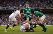 18 March 2017; Jack McGrath of Ireland is tackled by Courtney Lawes, right, and Owen Farrell of England during the RBS Six Nations Rugby Championship match between Ireland and England at the Aviva Stadium in Lansdowne Road, Dublin. Photo by Sam Barnes/Sportsfile