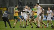 18 March 2017; Michael Murphy of Donegal being held back as both sets of players get involved in a second half incident during the Allianz Football League Division 1 Round 5 match between Donegal and Tyrone at MacCumhaill Park in Ballybofey, Co Donegal. Photo by Oliver McVeigh/Sportsfile