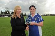 27 August 2011; Aisling Doonan, Cavan, is presented with the player of the match trophy by Helen O'Rourke, CEO of the Ladies Gaelic Football Association. TG4 All-Ireland Ladies Intermediate Football Championship Semi-Final, Cavan v Leitrim, Leahy Park, Cashel, Co. Tipperary. Picture credit: Brian Lawless / SPORTSFILE