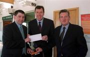 28 March 2001; Irish soccer hero Packie Bonner, in the company of Michael Murphy, right, Manager DART Suburban, today presented Brian Treacy, a DART commuter from Bray with a trip for two to Ireland's World Cup matches in Japan in June. Brian won the prize having purchased an annual DART/Suburban rail ticket under the Easi-Travel Plan, which was entered in the DART/Suburban rail prepaid ticket draw for the prize, which includes €2,002 spending money. Photo by Ray McManus/Sportsfile