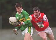 31 March 2002; Aodán Mac Gearailt of Kerry is tackled by Peter McGinnity of Louth during the Allianz National Football League Division 2A Round 7 match between Louth and Kerry at Páirc Mhuire in Ardee in Louth. Photo by Aoife Rice/Sportsfile