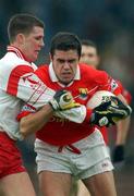 31 March 2002; Martin Cronin of Cork in action against Colin Holmes of Tyrone during the Allianz Football League Division 1A Round 7 match between Cork and Tyrone at Páirc Uí Chaoimh in Cork. Photo by Brendan Moran/Sportsfile