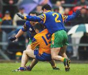 31 March 2002; John Hanley of Roscommon in action against Damien Diver, 2, and Mark Crossan of Donegal during the Allianz Football League Division 1A Round 7 match between Roscommon and Donegal at Dr Hyde Park in Roscommon. Please note Donegal wore the Roscommon  away strip due to a clash of jerseys. Photo by Ray McManus/Sportsfile