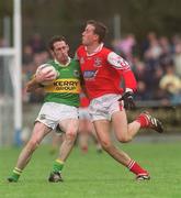 31 March 2002; John Sheehan of Kerry is tackled by Nicky McDonnell of Louth during the Allianz National Football League Division 2A Round 7 match between Louth and Kerry at Páirc Mhuire in Ardee in Louth. Photo by Aoife Rice/Sportsfile