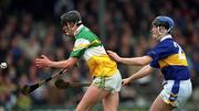 30 March 2002; Rory Hanniffy of Offaly in action against Michael Ryan of Tipperary during the Allianz National Hurling League Division 1B Round 1 match between Offaly and Tipperary in St Brendan's Park in Birr, Offaly. Photo by Brendan Moran/Sportsfile