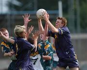 3 April 2002; Brendon Goddard of Australia, right, gathers possession ahead of Steven Salopek and Colm Kelly, 7, of Ireland during the U17 International Rules Second Test match between Ireland and Australia at Parnell Park in Dublin. Photo by Aoife Rice/Sportsfile