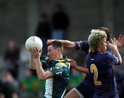 3 April 2002; Dermot McGlade of Ireland gathers possession ahead Scott Mathieson and Steven Salopek, 2, of Australia during the U17 International Rules Second Test match between Ireland and Australia at Parnell Park in Dublin. Photo by Aoife Rice/Sportsfile