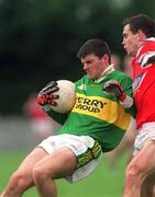 31 March 2002; Aodán Mac Gearailt of Kerry in action against Peter McGinnity of Louth during the Allianz National Football League Division 2A Round 7 match between Louth and Kerry at Páirc Mhuire in Ardee in Louth. Photo by Aoife Rice/Sportsfile