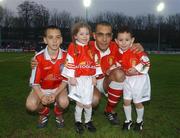 5 April 2002; Paul Osam with his children Daniel, left, 12 years, Rebecca, 5, and Evan, 4,  before the start of the game Paul Osam Testimonial Match between St Patrick's Athletic and Shamrock Rovers at Richmond Park in Dublin. Photo by David Maher/Sportsfile