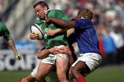 6 April 2002; Rob Henderson of Ireland is tackled by Serge Betsen, right, and Fabien Pelous of France during the Six Nations Rugby Championship match between France and Ireland at Stade de France in Paris, France. Photo by Matt Browne/Sportsfile