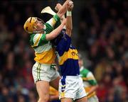 30 March 2002; Niall Claffey of Offaly in action against Benny Dunne of Tipperary during the Allianz National Hurling League Division 1B Round 1 match between Offaly and Tipperary in St Brendan's Park in Birr, Offaly. Photo by Brendan Moran/Sportsfile
