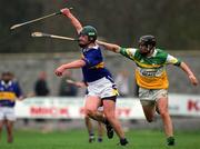 30 March 2002; David Kennedy of Tipperary in action against Brendan Murphy of Offaly during the Allianz National Hurling League Division 1B Round 1 match between Offaly and Tipperary in St Brendan's Park in Birr, Offaly. Photo by Brendan Moran/Sportsfile