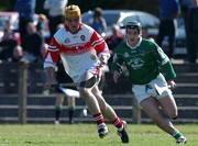7 April 2002; Dominic Magill of Derry in action against James Butler of Limerick during the Allianz National Hurling League Division 1B Round 5 match between Derry and Limerick at Erin's Owen GAA in Lavey, Derry. Photo by Ray McManus/Sportsfile
