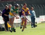 7 April 2002; Hubert Rigney of Offaly in action against Adrian Fenlon of Wexford during the Allianz National Hurling League Division 1B Round 5 match between Offaly and Wexford at St Brendan's Park in Birr, Offaly. Photo by Aoife Rice/Sportsfile