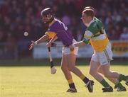 7 April 2002; Barry Goff of Wexford in action against Barry Whelahan, front, and John Paul O'Meara of Offaly during the Allianz National Hurling League Division 1B Round 5 match between Offaly and Wexford at St Brendan's Park in Birr, Offaly. Photo by Aoife Rice/Sportsfile