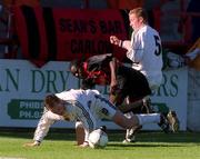 7 April 2002; Mark Rutherford of Bohemians in action against David Hoey and Stephen McGuinness, 5, of Dundalk during the FAI Carlsberg Senior Challenge Cup Final match between Bohemians and Dundalk at Tolka Park in Dublin. Photo by David Maher/Sportsfile