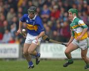 30 March 2002; Eoin Kelly of Tipperary in action against David Franks of Offaly during the Allianz National Hurling League Division 1B Round 1 match between Offaly and Tipperary in St Brendan's Park in Birr, Offaly. Photo by Brendan Moran/Sportsfile