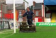 11 April 2002; Head Groundsman David Coombes cuts the grass in the goal mouth at Tolka Park in Dublin. Photo by Ray McManus/Sportsfile