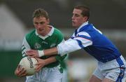 14 April 2002; Jer O'Shea of Coláiste na Sceilge is tackled by Gerald Aherne of St Jarlath's College during the Post Primary Schools Hogan Cup Senior A Football Championship Semi-Final match between St Jarlath's College and Coláiste na Sceilge at the Gaelic Grounds in Limerick. Photo by Matt Browne/Sportsfile