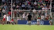14 April 2002; Colin Holmes of Tyrone scores his side's third goal past Mayo goalkeeper Peter Burke during the Allianz National Football League Division 1 Semi-Final match between Mayo and Tyrone at Brewster Park in Enniskillen, Fermanagh. Photo by Damien Eagers/Sportsfile