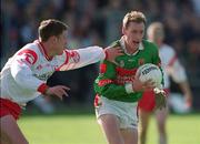 14 April 2002; James Nallen of Mayo in action against Cormac McAnallen of Tyrone during the Allianz National Football League Division 1 Semi-Final match between Mayo and Tyrone at Brewster Park in Enniskillen, Fermanagh. Photo by Damien Eagers/Sportsfile