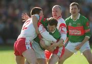 14 April 2002; David Nestor of Mayo in action against Conor Gourley, 2, and Chris Lawn of Tyrone during the Allianz National Football League Division 1 Semi-Final match between Mayo and Tyrone at Brewster Park in Enniskillen, Fermanagh. Photo by Damien Eagers/Sportsfile
