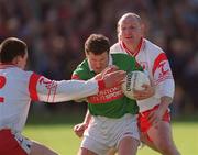 14 April 2002; David Nestor of Mayo in action against Conor Gourley, left, and Chris Lawn of Tyrone during the Allianz National Football League Division 1 Semi-Final match between Mayo and Tyrone at Brewster Park in Enniskillen, Fermanagh. Photo by Damien Eagers/Sportsfile