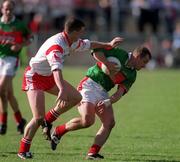 14 April 2002; Marty McNicholas of Mayo in action against Colin Holmes of Tyrone during the Allianz National Football League Division 1 Semi-Final match between Mayo and Tyrone at Brewster Park in Enniskillen, Fermanagh. Photo by Damien Eagers/Sportsfile