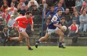 14 April 2002; Ian Fitzgerald of Laois is tackled by Aidan O'Rourke of Armagh during the Allianz National Football League Division 2 Semi-Final match between Armagh and Laois at Pearse Park in Longford. Photo by Ray McManus/Sportsfile