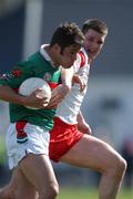 14 April 2002; James Gill of Mayo in action against Colin Holmes of Tyrone during the Allianz National Football League Division 1 Semi-Final match between Mayo and Tyrone at Brewster Park in Enniskillen, Fermanagh. Photo by Damien Eagers/Sportsfile
