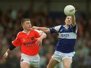 14 April 2002; Ian Fitzgerald of Laois in action against Aidan O'Rourke of Armagh during the Allianz National Football League Division 2 Semi-Final match between Armagh and Laois at Pearse Park in Longford. Photo by Ray McManus/Sportsfile
