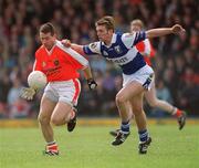 14 April 2002; Diarmuid Marsden of Armagh in action against Noel Garvan of Laois during the Allianz National Football League Division 2 Semi-Final match between Armagh and Laois at Pearse Park in Longford. Photo by Ray McManus/Sportsfile